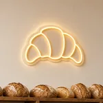 Néon LED Golden Croissant allumé, mis en situation dans un intérieur