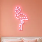 Pink Flamingo LED neon sign switched on in a real interior